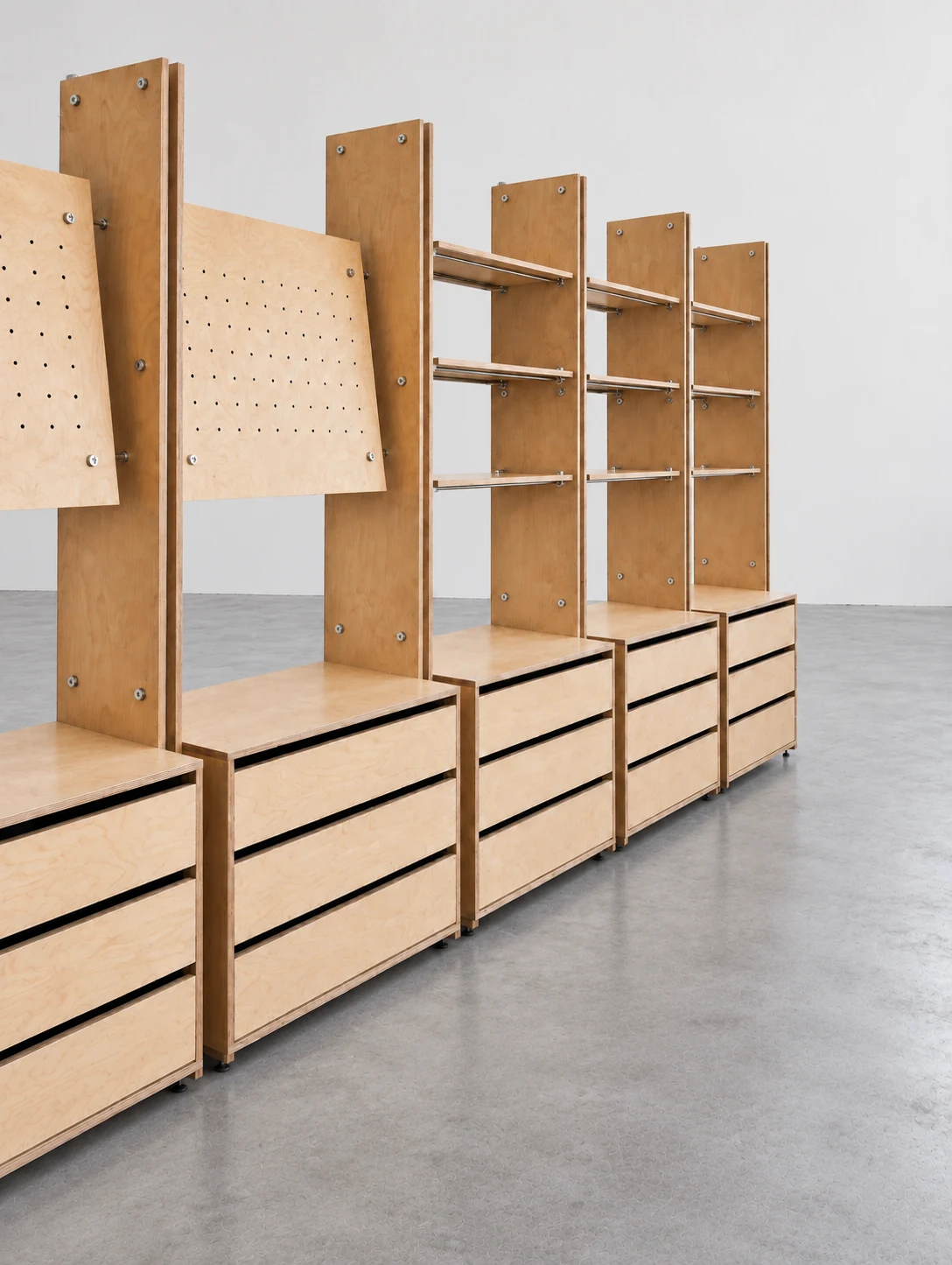 Modular timber retail display with pegboards, shelves and storage drawers