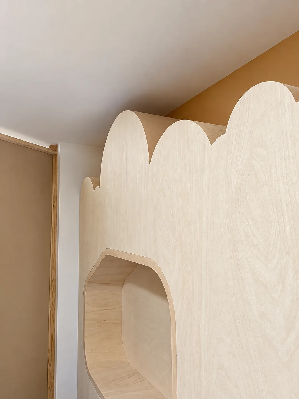 Close-up of curved natural timber joinery and layered edges