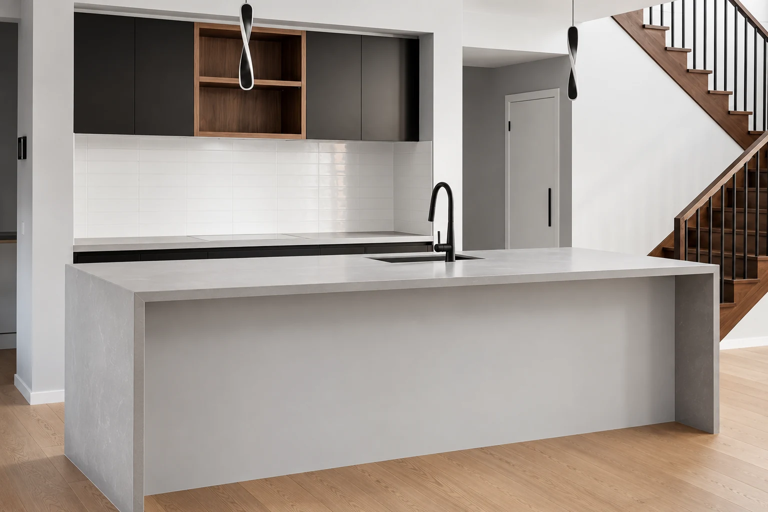 Grey peninsula kitchen with an open timber display niche