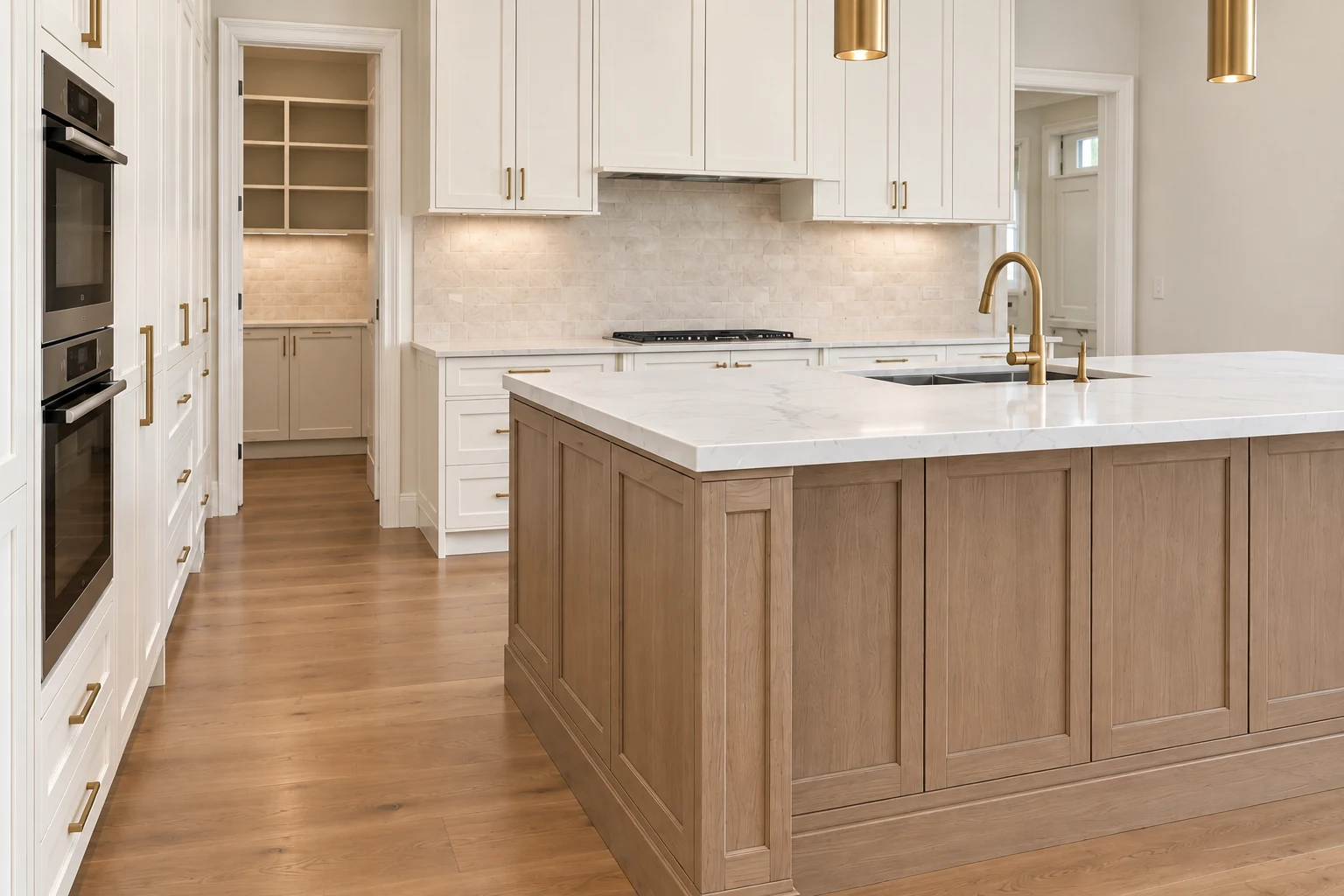 White and oak shaker cabinetry with brass fittings and a walk-in pantry