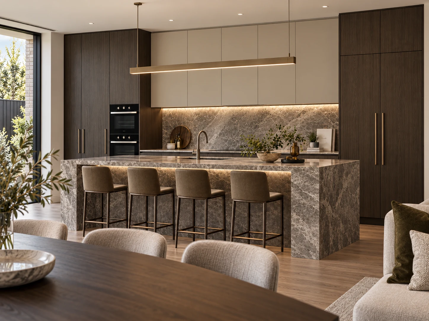 Dark walnut kitchen with a dramatic veined stone waterfall island